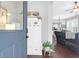 Bright entryway with keyless door lock, bench, and view of living room at 1442 Eutaw Battalion Dr, Charleston, SC 29412