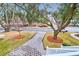Landscaped front yard with a brick walkway leading to the house at 1442 Eutaw Battalion Dr, Charleston, SC 29412