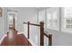 Bright hallway with hardwood floors and white railings at 1442 Eutaw Battalion Dr, Charleston, SC 29412