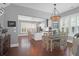 Modern kitchen with white cabinets, granite island, and stainless steel appliances at 1442 Eutaw Battalion Dr, Charleston, SC 29412