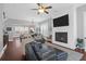 Spacious living room with hardwood floors, fireplace and large TV at 1442 Eutaw Battalion Dr, Charleston, SC 29412
