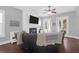 Relaxing living room features a sectional sofa, fireplace, hardwood floors, and French doors leading to backyard at 1442 Eutaw Battalion Dr, Charleston, SC 29412