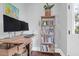 Home office with wood desk, two monitors, and a full bookshelf at 1442 Eutaw Battalion Dr, Charleston, SC 29412