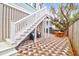 Patio with checkered brick flooring and white staircase at 1442 Eutaw Battalion Dr, Charleston, SC 29412