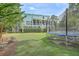 Backyard with trampoline and view of house at 1504 Rivertowne Country Club Dr, Mount Pleasant, SC 29466