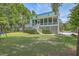 Large backyard with trampoline and house at 1504 Rivertowne Country Club Dr, Mount Pleasant, SC 29466