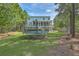 Large backyard with trampoline and trees at 1504 Rivertowne Country Club Dr, Mount Pleasant, SC 29466