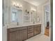 Double vanity bathroom with modern fixtures and a large mirror at 1504 Rivertowne Country Club Dr, Mount Pleasant, SC 29466