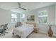 Bright bedroom with a queen bed, workspace, and plenty of natural light at 1504 Rivertowne Country Club Dr, Mount Pleasant, SC 29466