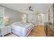 Bright bedroom featuring hardwood floors and en-suite bathroom access at 1504 Rivertowne Country Club Dr, Mount Pleasant, SC 29466