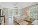 Main bedroom with hardwood floors and access to private deck at 1504 Rivertowne Country Club Dr, Mount Pleasant, SC 29466