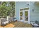 Private deck with wooded views and comfortable seating at 1504 Rivertowne Country Club Dr, Mount Pleasant, SC 29466