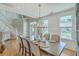 Bright dining room with hardwood floors and chandelier at 1504 Rivertowne Country Club Dr, Mount Pleasant, SC 29466