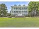 Two-story house with a large green lawn at 1504 Rivertowne Country Club Dr, Mount Pleasant, SC 29466
