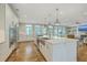 Open concept kitchen with island, stainless steel appliances, and view to Gathering room at 1504 Rivertowne Country Club Dr, Mount Pleasant, SC 29466