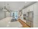 Modern kitchen with stainless steel appliances and white cabinetry at 1504 Rivertowne Country Club Dr, Mount Pleasant, SC 29466