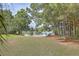 Scenic view of a peaceful lake with lush green landscaping at 1504 Rivertowne Country Club Dr, Mount Pleasant, SC 29466