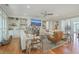 Spacious living room with built-in shelving, comfy sofas, and hardwood floors at 1504 Rivertowne Country Club Dr, Mount Pleasant, SC 29466