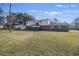 Large backyard with grassy area and a view of the home's rear at 1520 Acacia St, Charleston, SC 29407