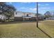Large backyard with grassy area and a view of the home's rear at 1520 Acacia St, Charleston, SC 29407