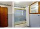 Small bathroom with blue tile, shower, and a single vanity at 1520 Acacia St, Charleston, SC 29407