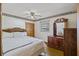 Bedroom with wood floors, ceiling fan and dresser at 1520 Acacia St, Charleston, SC 29407