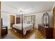Bedroom with hardwood floors, ceiling fan, and dresser at 1520 Acacia St, Charleston, SC 29407