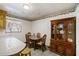 Small dining area with wood table and chairs, and a display cabinet at 1520 Acacia St, Charleston, SC 29407