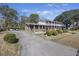 Two-story house with a long driveway and carport at 1520 Acacia St, Charleston, SC 29407
