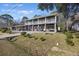 Two-story house with a porch and landscaped yard at 1520 Acacia St, Charleston, SC 29407
