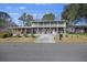 Two-story house with a large front porch and driveway at 1520 Acacia St, Charleston, SC 29407