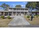 Two-story house with a porch and driveway at 1520 Acacia St, Charleston, SC 29407