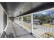 Long front porch overlooking the tree-lined street and homes at 1520 Acacia St, Charleston, SC 29407