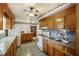 Cozy kitchen with wood cabinets, tile countertops, and a breakfast nook at 1520 Acacia St, Charleston, SC 29407