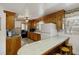 Galley kitchen with wood cabinets and tile countertops at 1520 Acacia St, Charleston, SC 29407