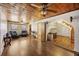 Living room with hardwood floors, wood ceiling, and access to upper level at 1520 Acacia St, Charleston, SC 29407