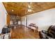 Living room with wood floors, a brick fireplace, and wood ceiling at 1520 Acacia St, Charleston, SC 29407