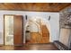 Open living space with hardwood floors, arched entry, and a staircase at 1520 Acacia St, Charleston, SC 29407