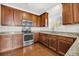 Kitchen with stainless steel appliances and wood cabinets at 1743 Bee Balm Rd, Johns Island, SC 29455