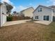 Home's backyard features a large concrete patio and a fenced-in area at 1813 Towne St, Johns Island, SC 29455