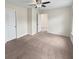 Bright bedroom with neutral walls and carpet flooring, offering ample space and a ceiling fan at 1813 Towne St, Johns Island, SC 29455