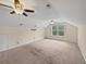 Spacious bonus room with vaulted ceiling, window, and ceiling fans at 1813 Towne St, Johns Island, SC 29455