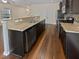 Dark kitchen cabinets, granite countertops, and stainless steel appliances at 1813 Towne St, Johns Island, SC 29455