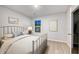 Bedroom with a full-size bed, window, and adjacent closet at 189 W Bradford Pointe Dr, Summerville, SC 29486