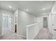Upstairs hallway with carpeted flooring and multiple doors at 189 W Bradford Pointe Dr, Summerville, SC 29486