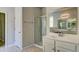 Bathroom with double vanity, large mirror and a shower at 207 Bilge Rd, Ridgeville, SC 29472