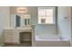 Relaxing bathroom with soaking tub, double vanity and large mirror at 207 Bilge Rd, Ridgeville, SC 29472