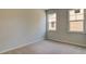 Bright bedroom with two large windows and neutral carpeting at 207 Bilge Rd, Ridgeville, SC 29472