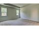 Spacious bedroom with neutral carpeting and two windows at 207 Bilge Rd, Ridgeville, SC 29472