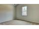 Well-lit bedroom featuring a large window and neutral walls at 207 Bilge Rd, Ridgeville, SC 29472